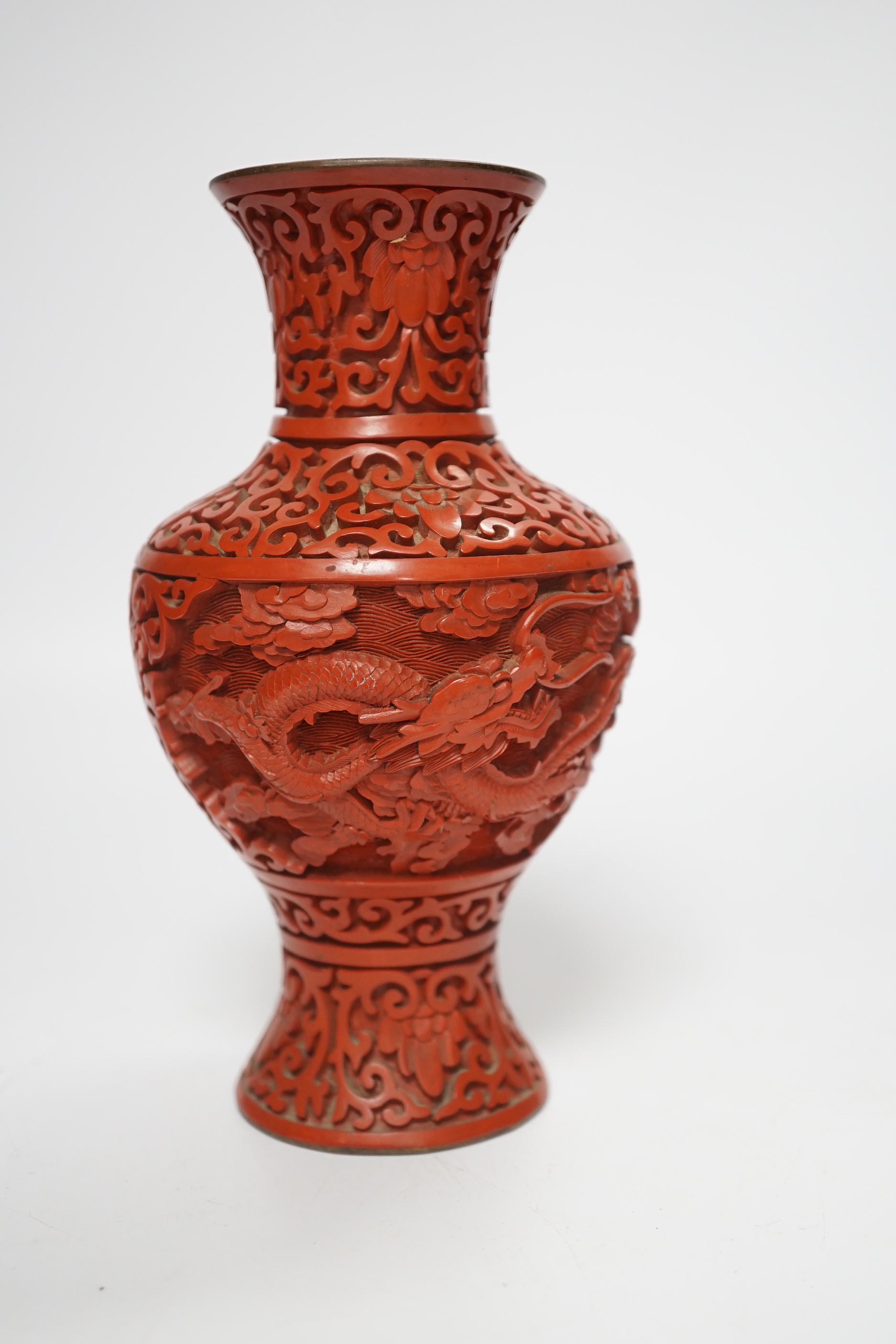 Three Chinese cinnabar lacquer items, a vase, an ashtray and a lidded box, vase 16.5cm